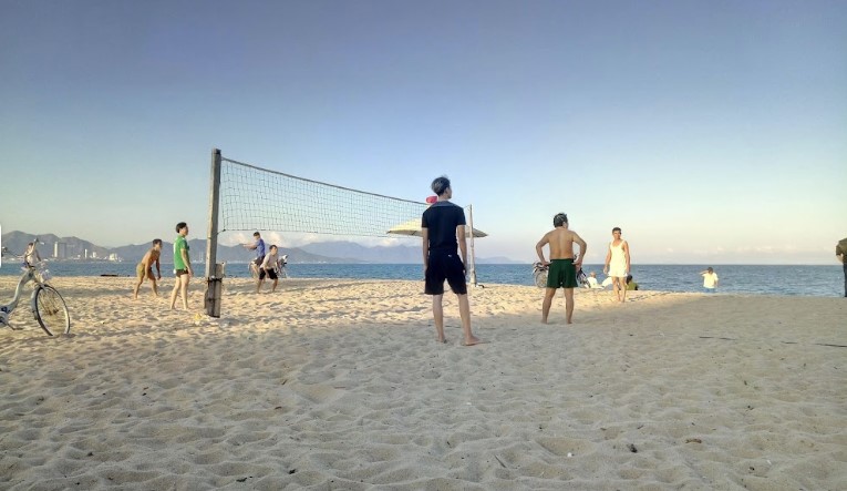 A photo of people playing volleyball at lovers football field